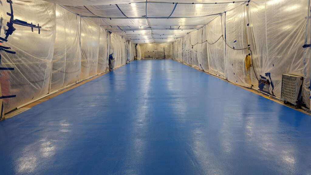 Containtment area inside an active food processing facility to minimize dusting.