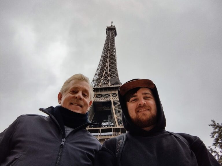 Clinton Parker visiting the Eiffel Tower in Paris with his father