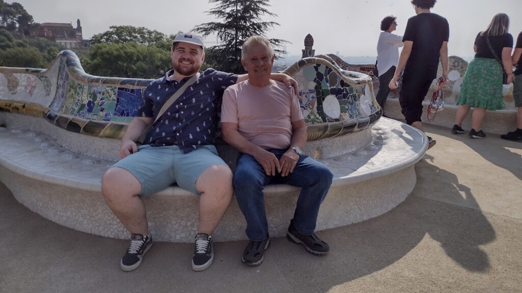 Clinton Parker and his dad sitting on a bench